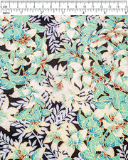 Japanese chiyogami paper featuring green and white leaves with metallic silver leaves on a black background with metallic gold details, shown next to a ruler for size reference.