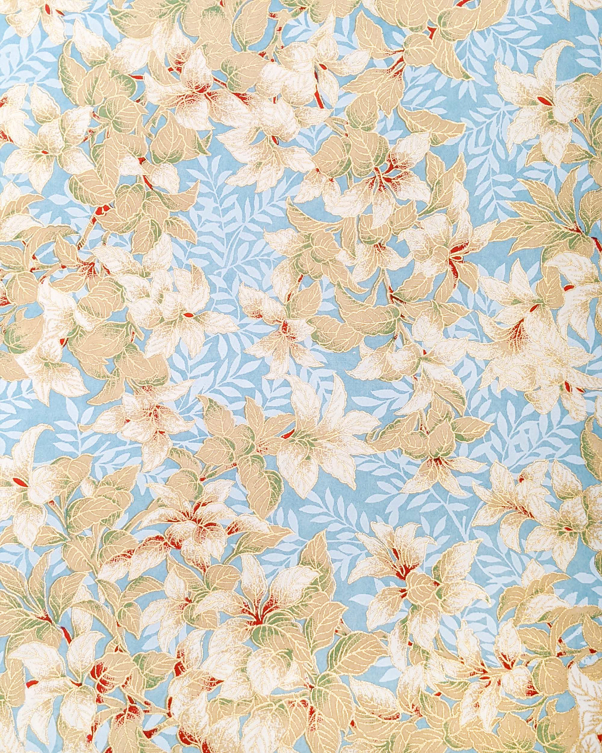 Japanese chiyogami paper featuring beige and white leaves with light blue leaves on a light blue background with metallic gold details.