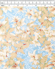Japanese chiyogami paper featuring beige and white leaves with light blue leaves on a light blue background with metallic gold details, shown next to a ruler for size reference.