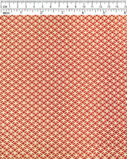Japanese chiyogami paper featuring a traditional oval shippo pattern in metallic gold with four white dots in the center on a red background, shown next to a ruler for size reference.