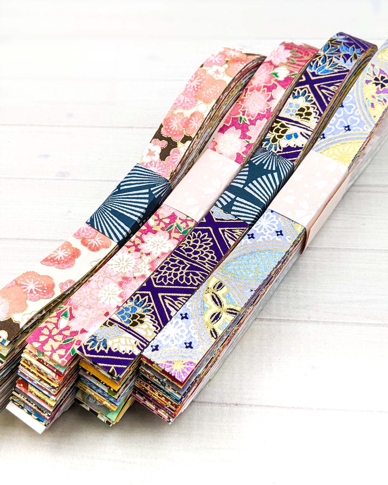 Packs of thin strips of origami papers used for folding origami stars.